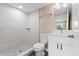 Modern bathroom with a tiled shower, new toilet, and vanity with a sink at 21536 Holdern Ave, Port Charlotte, FL 33952