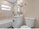 Bathroom featuring a bathtub, shower, toilet, vanity, and modern fixtures at 21536 Holdern Ave, Port Charlotte, FL 33952