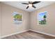Bedroom featuring hardwood floors, neutral paint, and lots of natural light at 21536 Holdern Ave, Port Charlotte, FL 33952