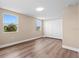 Bedroom featuring hardwood floors, neutral paint, a closet and lots of natural light from 2 windows at 21536 Holdern Ave, Port Charlotte, FL 33952