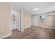 Bedroom featuring hardwood floors, neutral paint, ensuite bathroom, and lots of natural light at 21536 Holdern Ave, Port Charlotte, FL 33952