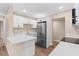 Modern kitchen featuring white cabinets, stainless steel appliances, and sleek countertops at 21536 Holdern Ave, Port Charlotte, FL 33952
