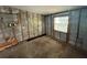 Unfinished basement with exposed concrete block and window at 2175 20Th Sw Ave, Largo, FL 33774