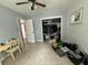 Bedroom with a ceiling fan, natural light, and an untidy walk-in closet at 2175 20Th Sw Ave, Largo, FL 33774
