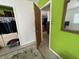 A view from inside the bedroom to the corridor, highlighting closet access and natural light at 2175 20Th Sw Ave, Largo, FL 33774