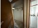 Small closet with a hanging rack, adjacent to the interior at 2175 20Th Sw Ave, Largo, FL 33774
