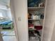 Organized closet view showing storage space for a bedroom with linens and supplies at 2175 20Th Sw Ave, Largo, FL 33774