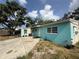Charming single-story home featuring a bright blue exterior, concrete driveway, and front entrance at 2175 20Th Sw Ave, Largo, FL 33774