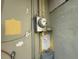 Close-up of electric meter attached to the exterior of the home at 2175 20Th Sw Ave, Largo, FL 33774