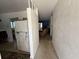 Interior shot showing hallway, kitchen, and living area of home at 2175 20Th Sw Ave, Largo, FL 33774
