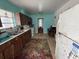 Functional kitchen with wooden cabinets, appliances, and a window for natural light at 2175 20Th Sw Ave, Largo, FL 33774