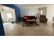Inviting living room with comfortable seating, textured walls and open access to the kitchen at 2175 20Th Sw Ave, Largo, FL 33774