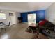 Spacious living room design with a blue accent wall and comfortable seating at 2175 20Th Sw Ave, Largo, FL 33774
