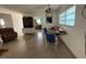 Bright living area featuring terrazzo floors, open layout and a dining space at 2175 20Th Sw Ave, Largo, FL 33774