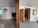 Living room with a window unit, tv and original wood door frame at 2175 20Th Sw Ave, Largo, FL 33774