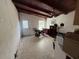 Living room featuring a ceiling fan, tile flooring, and a white-painted door at 2175 20Th Sw Ave, Largo, FL 33774