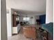 Open living room layout featuring a dining area and lounge space with blue accent wall at 2175 20Th Sw Ave, Largo, FL 33774