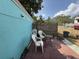 The patio area with a table and chairs, fenced-in for privacy at 2175 20Th Sw Ave, Largo, FL 33774