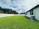 Large, fenced backyard featuring lush green grass, perfect for outdoor activities and relaxation at 219 Lovely Ct, Plant City, FL 33566