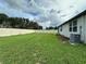 Spacious backyard enclosed by a white fence, providing privacy and security at 219 Lovely Ct, Plant City, FL 33566