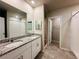 Modern bathroom featuring double vanity, granite countertops and tiled floor at 219 Lovely Ct, Plant City, FL 33566