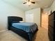Bedroom with ceiling fan, and plush bed with blue bedding at 219 Lovely Ct, Plant City, FL 33566