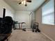 Bedroom set up as workout space with ceiling fan and a window with blinds at 219 Lovely Ct, Plant City, FL 33566