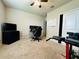 Bedroom with tv setup as office space with ceiling fan and white dry erase board at 219 Lovely Ct, Plant City, FL 33566