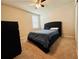 Bedroom with ceiling fan, dark dresser and plush bed with blue bedding at 219 Lovely Ct, Plant City, FL 33566