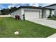 Well maintained home with a two car garage and green lawn at 219 Lovely Ct, Plant City, FL 33566