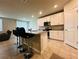 Stylish kitchen with granite countertops, stainless steel appliances, and bar stools for casual dining at 219 Lovely Ct, Plant City, FL 33566