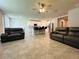 Open-concept living room seamlessly connects to the modern kitchen, offering a spacious and inviting atmosphere at 219 Lovely Ct, Plant City, FL 33566