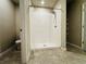 Bright bathroom shower with white tile and tile flooring at 219 Lovely Ct, Plant City, FL 33566