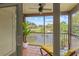 Relaxing screened balcony with chaise lounge overlooking a golf course and scenic water view at 2400 Feather Sound Dr # 528, Clearwater, FL 33762