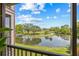 Scenic balcony view overlooking a lake and golf course with vibrant sky at 2400 Feather Sound Dr # 528, Clearwater, FL 33762