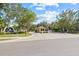 Gated entrance to the community features a guardhouse and manicured landscaping at 2400 Feather Sound Dr # 528, Clearwater, FL 33762