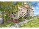 Inviting exterior of a two-story condo building with lush landscaping and a stairway entrance at 2400 Feather Sound Dr # 528, Clearwater, FL 33762