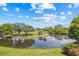 Beautiful view overlooking a scenic pond and lush golf course under a bright, sunny sky at 2400 Feather Sound Dr # 528, Clearwater, FL 33762