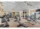 Bright community gym features weight and cardio machines, free weights, and mirrored walls at 2400 Feather Sound Dr # 528, Clearwater, FL 33762