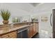 Stylish kitchen with granite countertops, stainless steel appliances, and a breakfast bar at 2400 Feather Sound Dr # 528, Clearwater, FL 33762