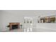 Spacious living room with tiled floors, fireplace, and an open floor plan leading to the kitchen at 2400 Feather Sound Dr # 528, Clearwater, FL 33762