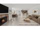 Cozy living room features a fireplace, dining area, and modern kitchen with a breakfast bar at 2400 Feather Sound Dr # 528, Clearwater, FL 33762