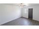 This bedroom has a simple design with grey wood floors, white walls, and lots of natural light at 2425 Wishing Well Cir, Tampa, FL 33619