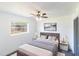 Cozy bedroom with a comfortable bed, neutral decor, and plenty of natural light at 2425 Wishing Well Cir, Tampa, FL 33619