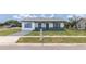 Charming single-story house with a well-kept lawn and long driveway at 2425 Wishing Well Cir, Tampa, FL 33619