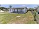 Charming home with well-kept lawn and a long driveway on a sunny day at 2425 Wishing Well Cir, Tampa, FL 33619