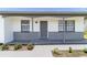 Charming single-story home featuring a freshly painted exterior and lovely front porch at 2425 Wishing Well Cir, Tampa, FL 33619