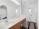 Bathroom featuring a modern vanity, large mirror, and a separate toilet and shower area at 24841 Mary Beth Ct, Land O Lakes, FL 34639