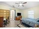 Bright bedroom with vaulted ceilings, a ceiling fan, and a large window for ample natural light at 24841 Mary Beth Ct, Land O Lakes, FL 34639