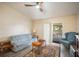Inviting living room with hardwood floors, ceiling fan, and natural light at 24841 Mary Beth Ct, Land O Lakes, FL 34639